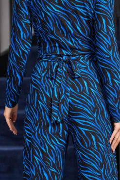 Blue Animal Print Wrap Front Wide Leg Jumpsuit With Pockets -Opal & Oak Store web rt 107 a20jj004blan01 108